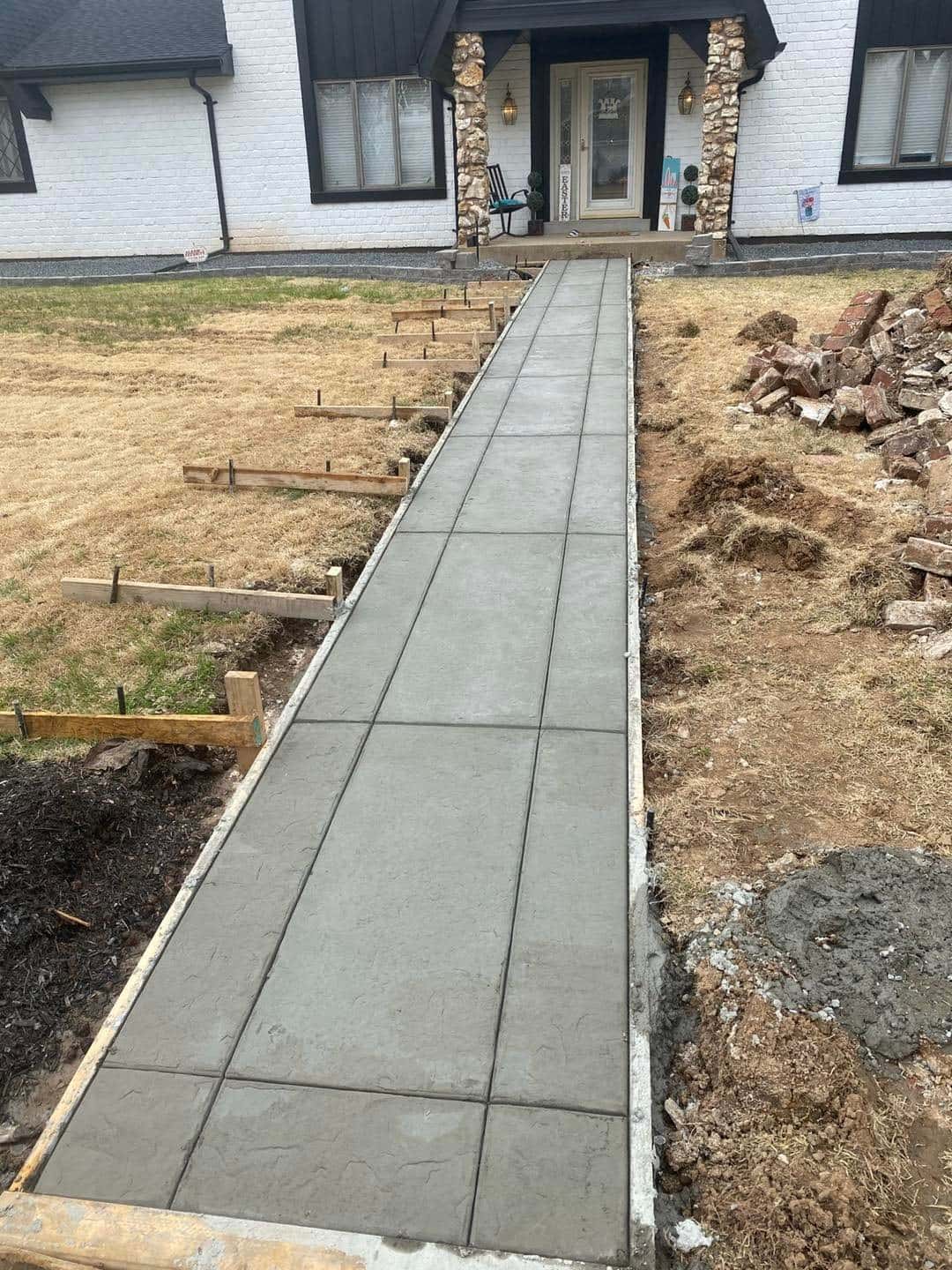 Wet concrete being screeded and floated during a Western Kentucky pour